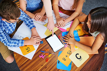 Poster - Children, teacher and tablet in classroom with help, mockup space and blank screen for education. People, above and group learning with books, maths and point at touchscreen for development at school
