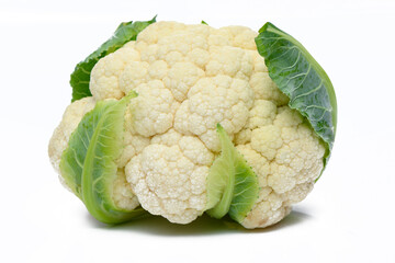 whole head of the fresh raw cauliflower with some leaves close-up on a white background 1