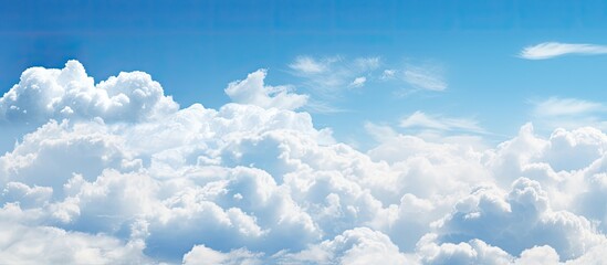 Poster - Beautiful white clouds under blue sky background. Creative banner. Copyspace image