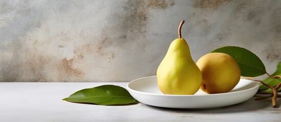 Leinwandbilder - Fresh bio pear with leaves on the plate Gray stone table. Creative banner. Copyspace image