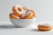© Sandu - Bowl of powdered donuts