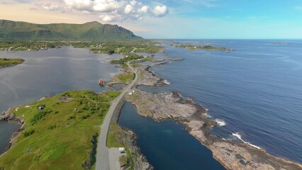 Wall Mural - A stunning aerial video of a road curving through water to reach a small island in the ocean. Beautiful views offer peace and tranquility, ideal for a serene escape, Atlantic Ocean Road Norway