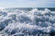 © isavira - Sea wave close-up, water splash in the sea, sea foam against the sky on a summer sunny day