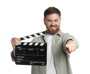 Poster - Making movie. Smiling man with clapperboard pointing at camera on white background