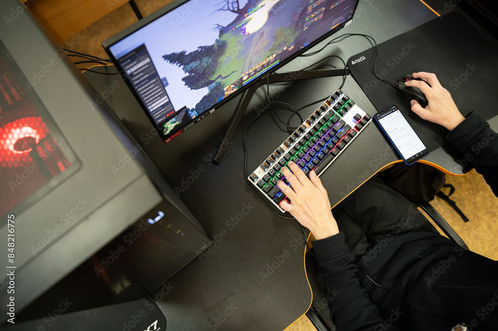 ภาพถ่าย Stock Focus on Hands, Keyboards and Mouse. Back view of young ...