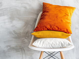 Wall Mural - Cozy concept captured with cushions on a chair against a white backdrop