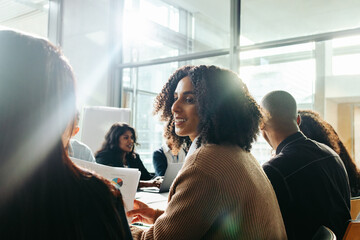 Wall Mural - businesswoman collaborating with diverse team during a business meeting