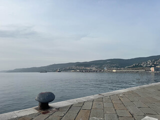 Canvas Print - Trieste,View on Miramare castle on the gulf of Trieste on northeastern Italy. Long exposure image technic with reflection on the water