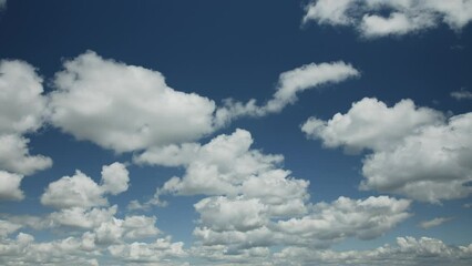 Wall Mural - time lapse video, slow movement of white clouds in sky on a sunny spring day.