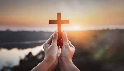 Wall Mural - Wooden Christian Cross being held by Dark Skinned Hand - Symbol of Christianity - Believe and Faith in Christ or God - Praying or Wishing - Worshipping of Religion - Asking for Blessing from Above