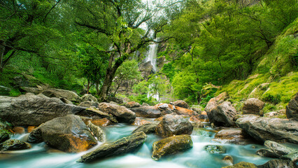 Wall Mural - Beauty in nature, amazing waterfall in tropical forest of national park, Thailand