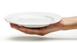 © pector - A hand holding a white plate empty there is nothing