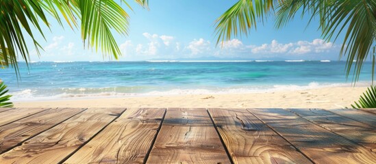 Wall Mural - Wooden table set against the backdrop of a picturesque summer day at the beach, featuring palm leaves and the soothing blue sea, offering ample space for displaying products.