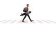 © Ljupco Smokovski - Full length profile shot of a male student walking and holding a longboard at a pedestrian crossing