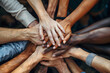 © Yuliia - A diverse group of hands stacked together, symbolizing unity and teamwork. Ideal for themes of diversity, collaboration, and community building.