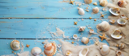 Wall Mural - Summer vibes with sand and shells scattered across a blue, wooden floor