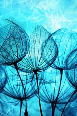 Wall Mural - Silhouette of dandelion seeds in vibrant blue sky with bokeh background, showcasing wispy details