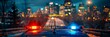 © Ilja - Police car flashing blue and red lights against city night skyline, displaying authority