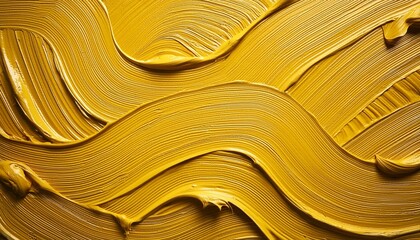 Wall Mural - abstract monochrome closeup texture of mustard yellow oil paint with streaks from the brush in the form of waves on the palette