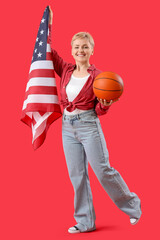 Wall Mural - Young woman with ball and USA flag on red background