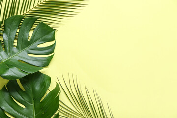 Poster - Different tropical leaves on yellow background