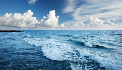Wall Mural - soft ocean wave blue water and beautiful cloudy sky