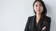 © The Little Hut - Portrait of young Asian business woman on white background : Generative AI