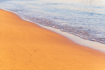 Wall Mural - Soft wave of the sea on the sandy beach.