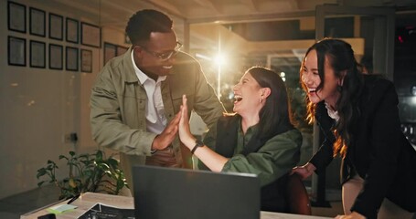 Fototapete - Women, man and high five in night at office for smile, success and laptop for teamwork at media company. Writer, group and excited for cheers, celebration or diversity in workplace at creative agency