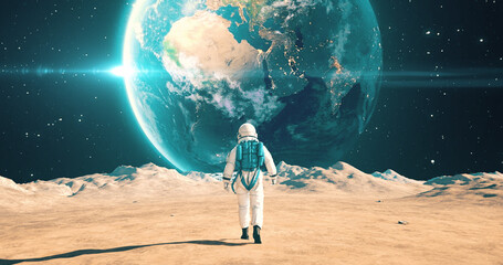 Wall Mural - brave astronaut walking on an alien planet. planet earth in sky. space related majestic scene.