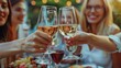 © itchaznong - People toasting wine at party in luxury outdoor restaurant terrace