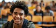 © Anastasiia - Engaged Black Student Smiling and Making Eye Contact in Lecture Hall. Concept Education, Engagement, Student Life, Diversity, Smiling