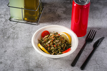 Wall Mural - Healthy salad with capers, quinoa and walnuts on stone table