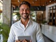 © Thares2020 - Satisfied Businessman Holding Tablet Showing Impressive Sales Growth Data