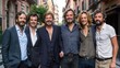 © AdriFerrer - A group of men are posing for a photo, with one of them wearing a suit