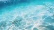 © venusvi - A tropical beach water pattern with vibrant turquoise water and delicate bubbles floating on the surface of the water.