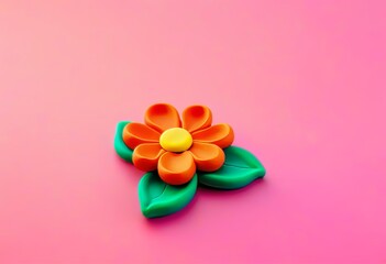 Wall Mural - A colorful plasticine flower on a pink background