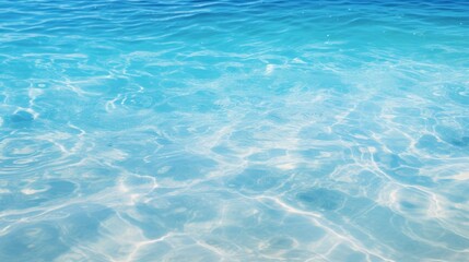 Wall Mural - close-up tropical beach water pattern background with vibrant blue water, sunlight reflecting off the surface, and a sense of endless possibilities and freedom.