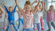 © Oleksiy - Smiling girls and boys doing dance workout during group class in fitness center