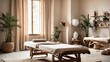 © Ольга Симонова - The interior of the massage room in eco-style and beige tones with natural fabrics and materials, Potted plants. Rolled towels on the massage table, candles, relaxing atmosphere.