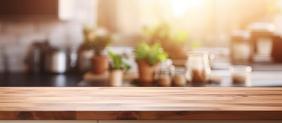 Wall Mural - Blurred kitchen background with a wood table top can be utilized as a mock up for displaying products or design layout with copy space image