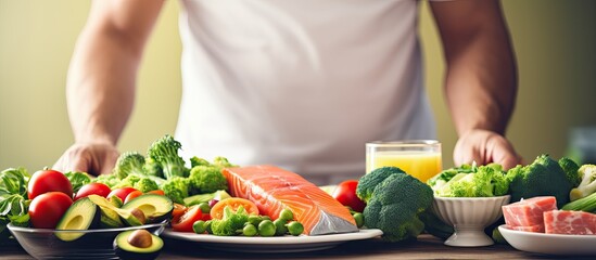 Canvas Print - Close up image of a man displaying a thumbs up gesture with protein rich food ideal for sport fitness and healthy lifestyle concepts with copy space