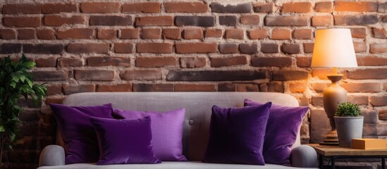 Poster - A cozy interior design with a brick wall purple pillow lamp decor and a space for adding text or images. Copy space image. Place for adding text and design