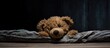 © Ilgun - Teddy bear with eyes covered in an empty room front view copy space image available
