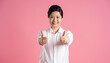 © Q88 - Image of older Asian businesswoman posing on pink background