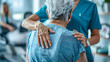 © Cadengo - copy space, physiotherapist touching the back of an elderly woman during excercises