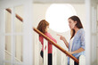 © DL/peopleimages.com - Mother, girl child and pointing for discipline on stairs, warning for mistake in home. Woman, daughter and finger sign for angry conversation in house, together with conflict or chat for development
