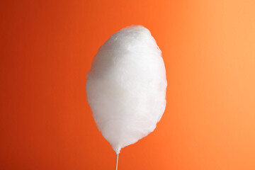 Wall Mural - One sweet cotton candy on orange background