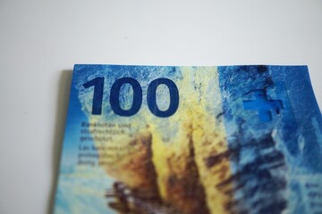 one hundred swiss francs on white background - swiss franc banknote close up