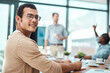 © DoneDeal/peopleimages.com - Portrait, smile and business man writing notes in office meeting for coworking in startup. Face, data analyst and happy professional entrepreneur on notebook for information, statistics or career